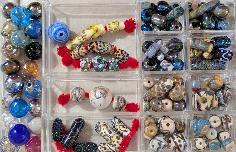 Beads of several types, blown bubbles, decorated with silver glass